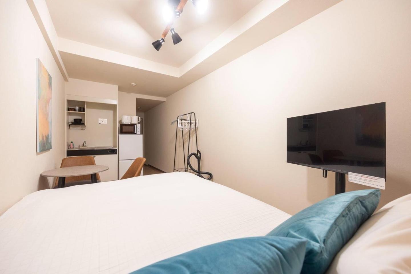 Shinjuku Okada Building Apartman Tokió Szoba fotó