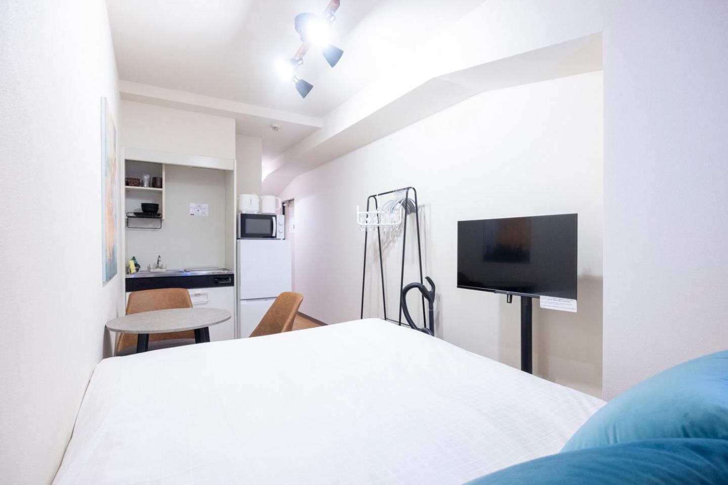 Shinjuku Okada Building Apartman Tokió Szoba fotó