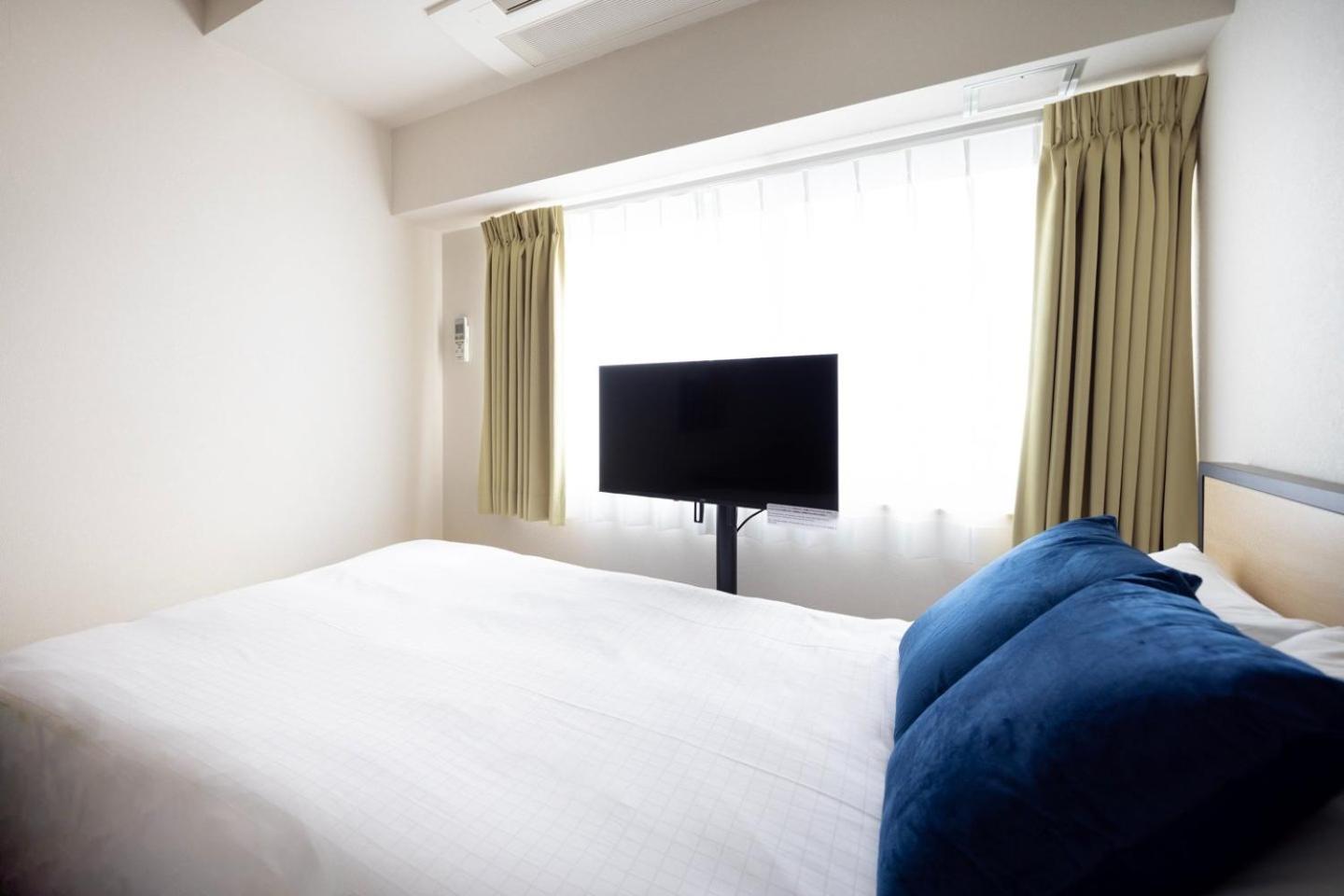 Shinjuku Okada Building Apartman Tokió Szoba fotó