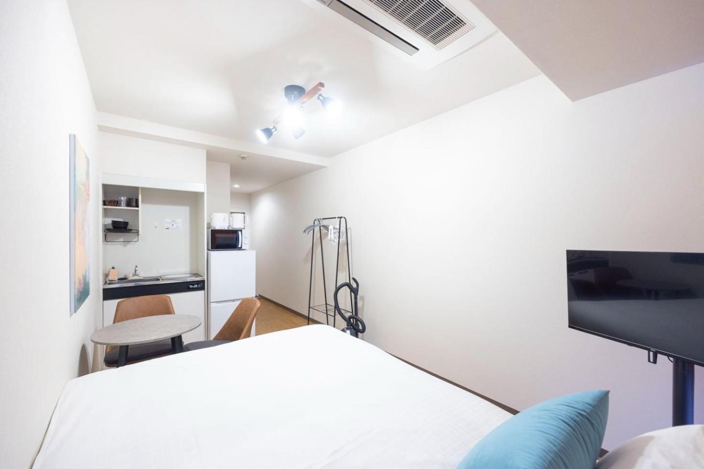 Shinjuku Okada Building Apartman Tokió Szoba fotó